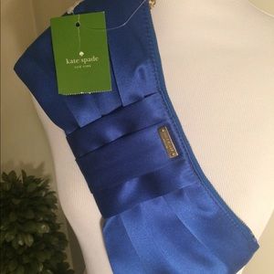 Kate Spade silky blue clutch with wrist strap.